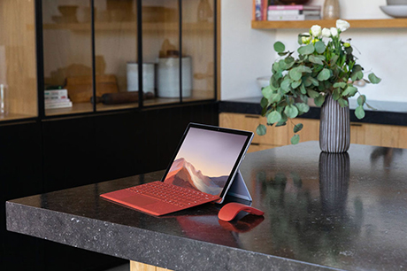 Red laptop on counter top