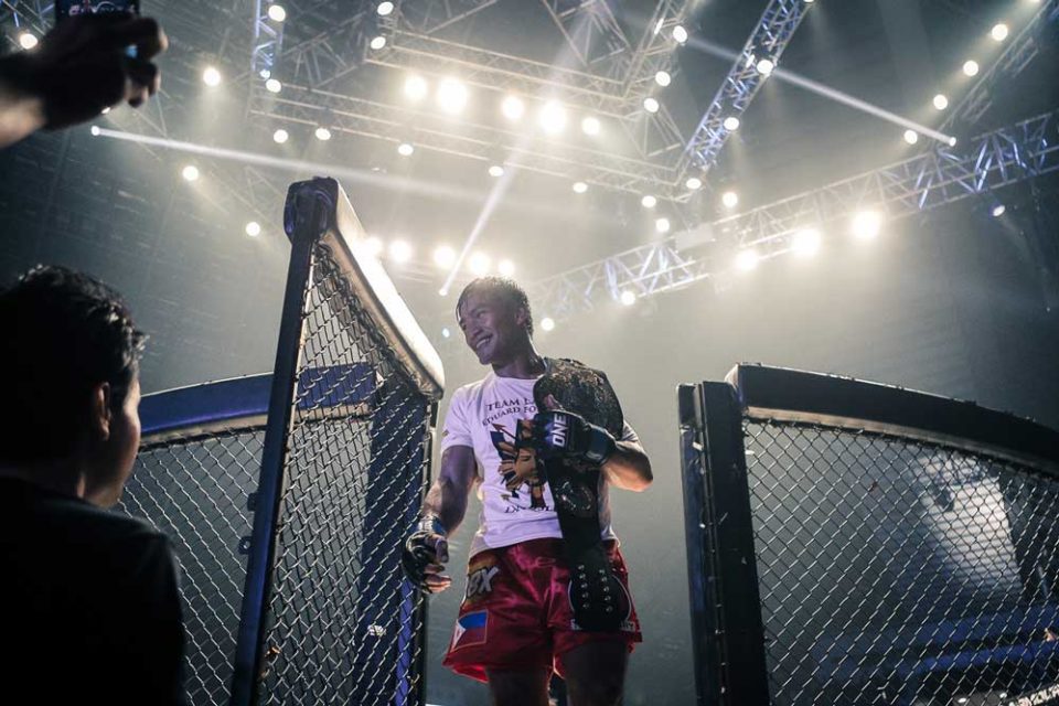 ONE Championship lightweight champion Eduard Folayang exiting the ONE cage after a victory.