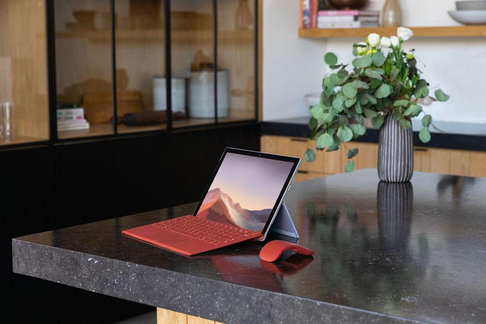 Red laptop on counter top