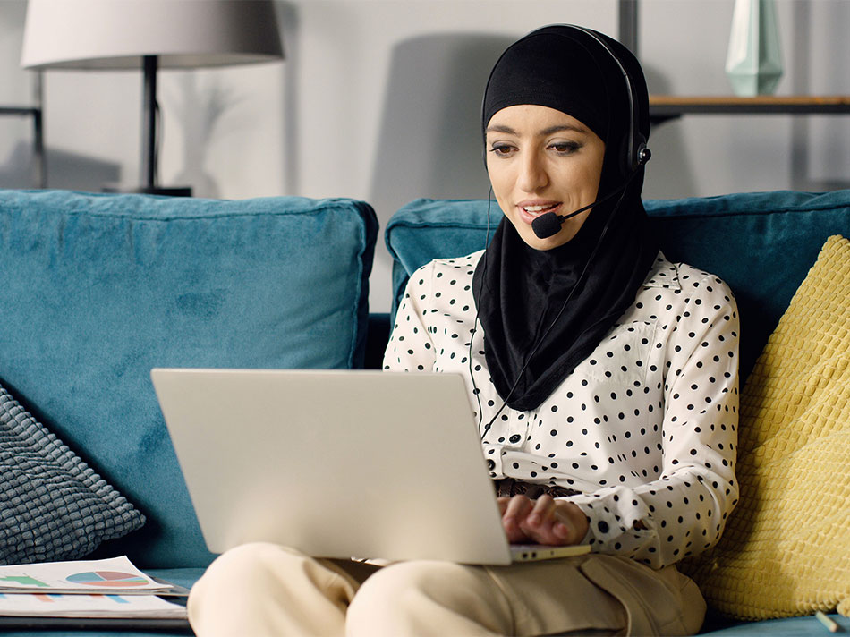 Middle Eastern woman working from home on her laptop