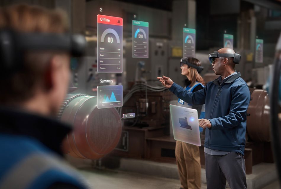 Two men and a woman collaborating using Microsoft Hololens 2 on the manufacturing floor.