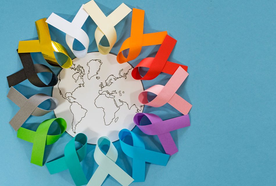colourful Cancer awareness ribbons - blue, red, green, pink, orange, violet, white, black, gold, grey and yellow colour on blue background for supporting people living with Cancer