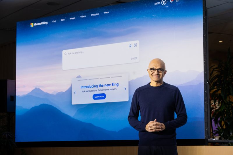 Man stands in front of Microsoft Bing screen