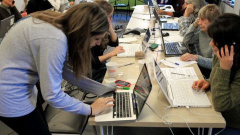 people work on laptops at Obama's headquarters in Boston