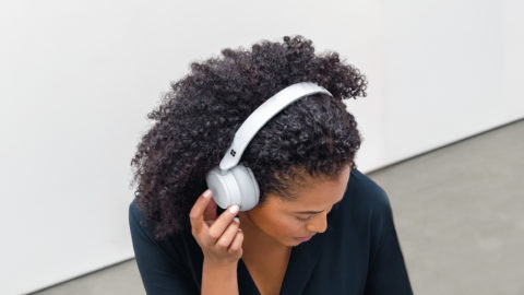 a woman listening to headphones