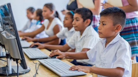 Stock image of young students at computers