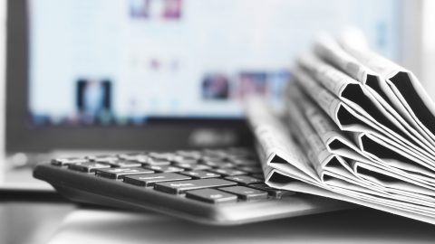 Newspapers lying on a keyboard