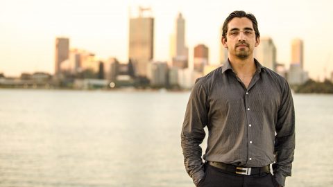 Photo of Kashif Saleem, founder and CEO of Track'em, with cityscape in background