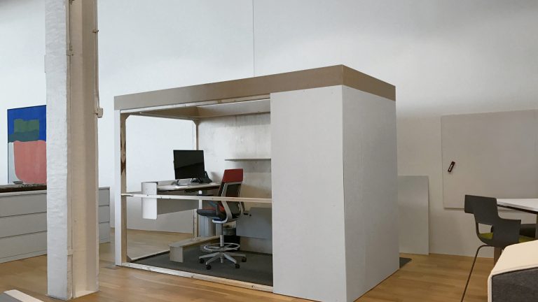 The CEO office evolves into a small white box made of cardboard.
