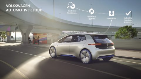 A Volkswagen prototype cruises down a city street to illustrate the new Volkswagen Automotive Cloud