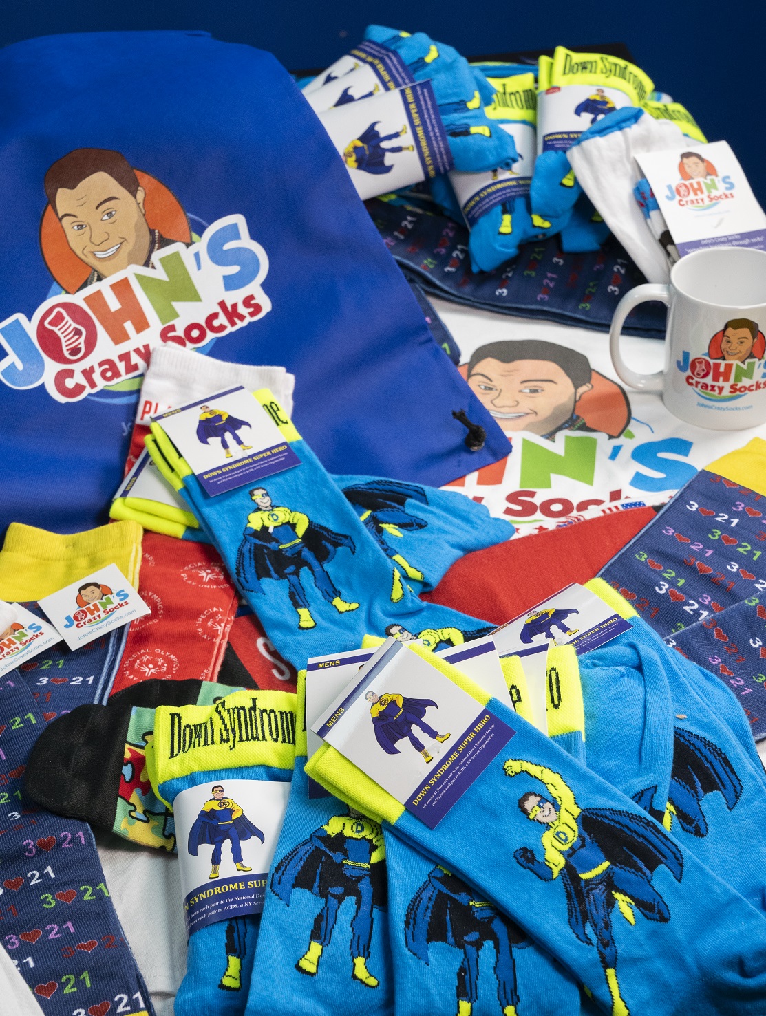 colorful socks, including a blue and yellow Down syndrome superhero sock