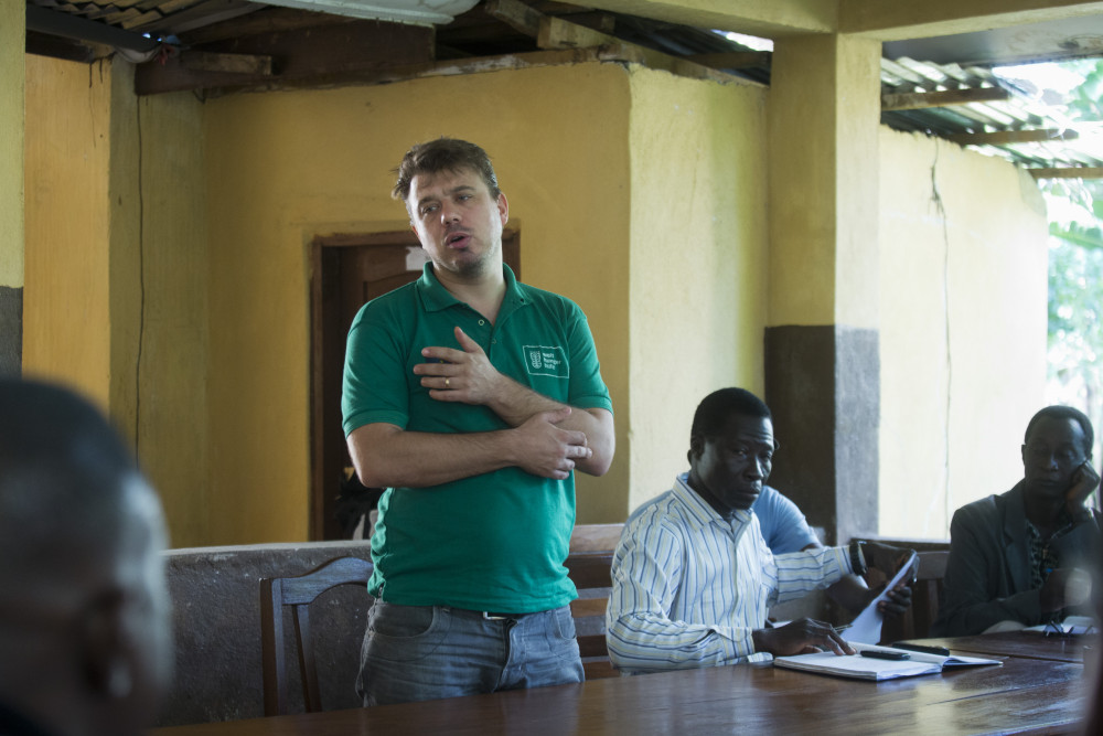 Jochen Moninger speaks with residents in Sierra Leone. 