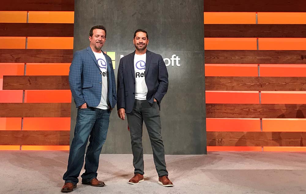 Jeff and Dion stand together at a Microsoft event