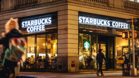 A Starbucks storefront at night.