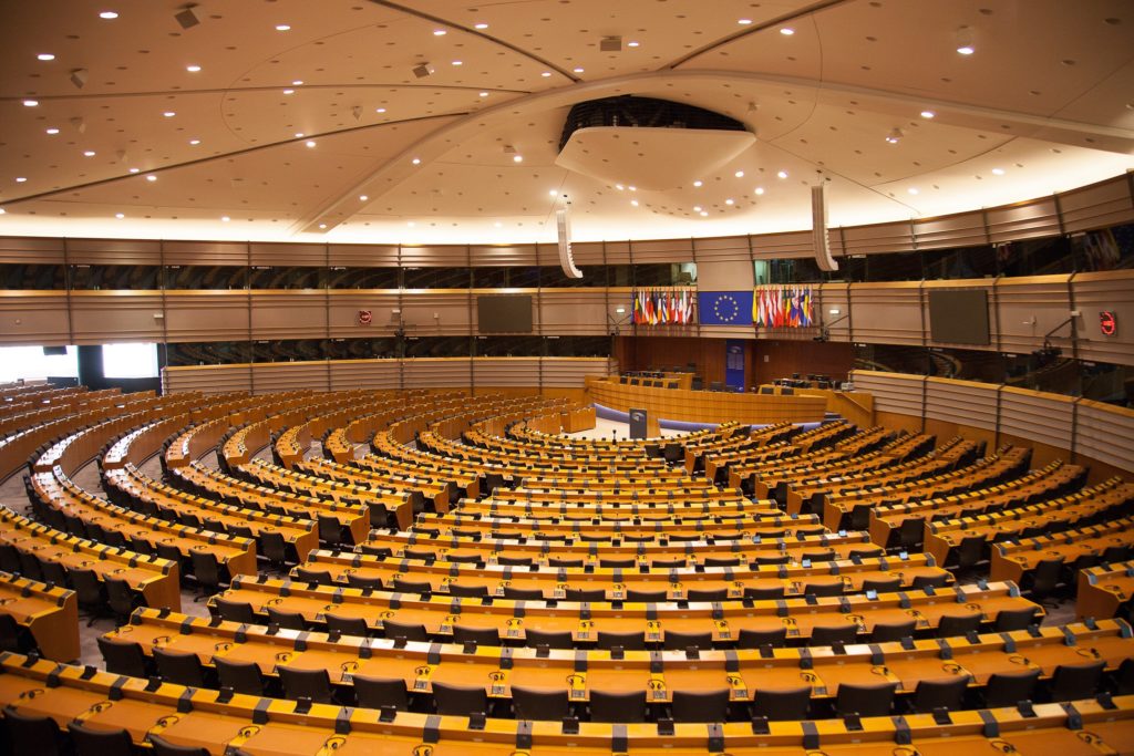 Rings of empty seats inside the European Parliament building.