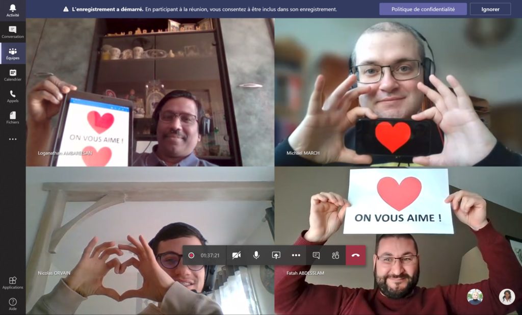 Teams video call with four people holding up heart signs supporting frontline workers