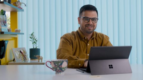 Vivek Prabhakar, co-founder of Chumbak, sits at a desk with his laptop