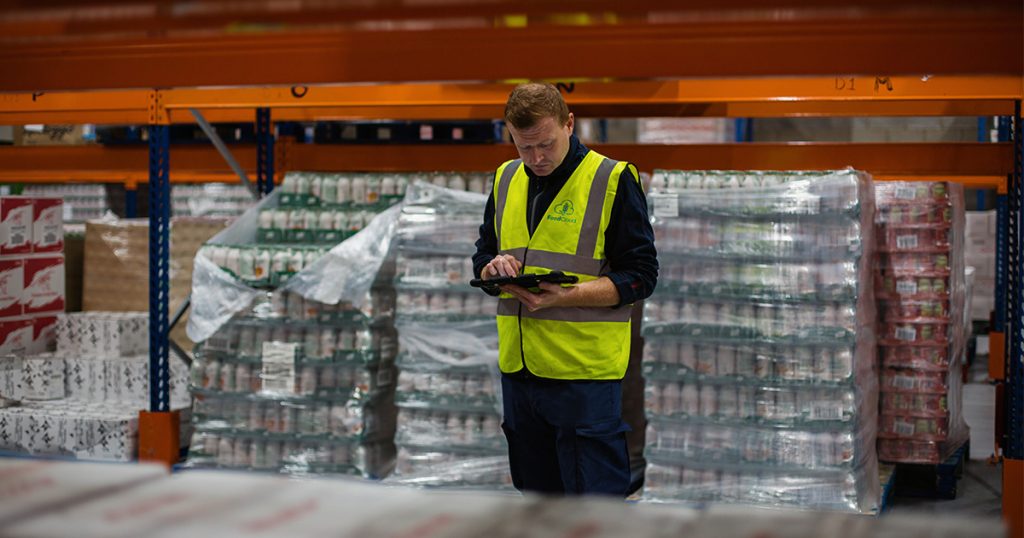 An employee prepares delivery orders at the FoodCloud warehouse in Dublin