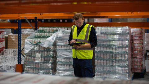 An employee prepares delivery orders at the FoodCloud warehouse in Dublin