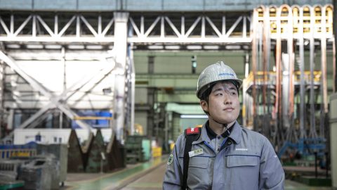 Wontaek Lee stands in the factory at Doosan Enerbility