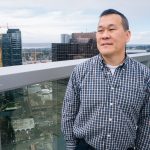 Walter Sun enjoys the rooftop deck at the City Center office