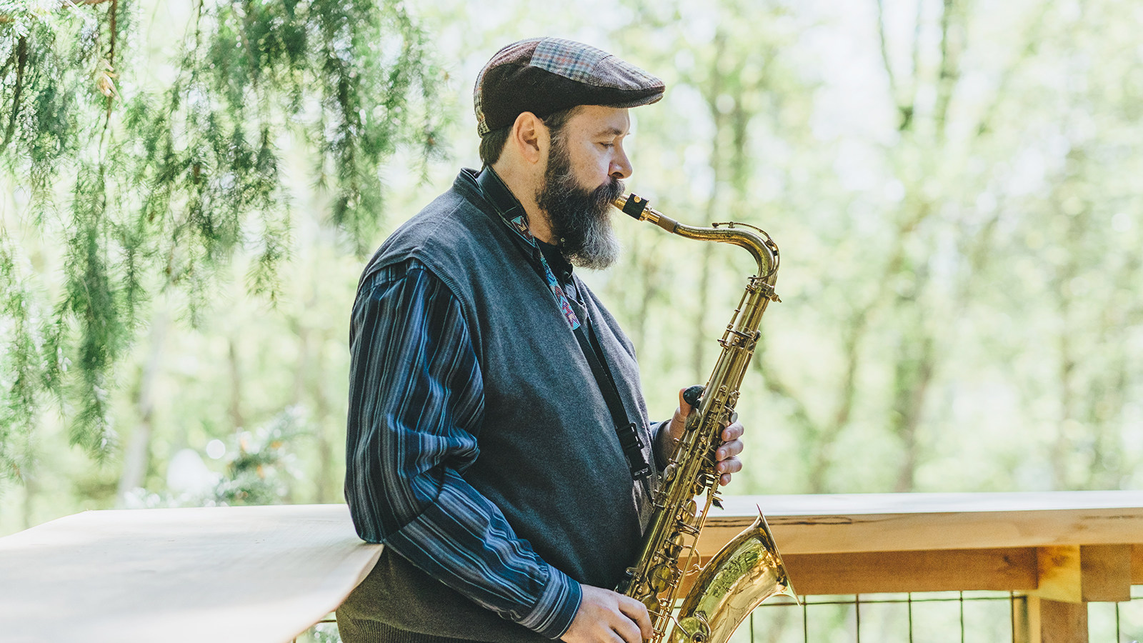 a photo of a man playing a saxophone