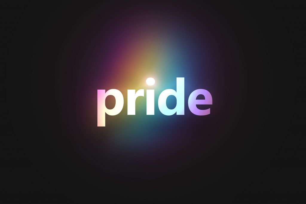 The word "pride" written in white with a rainbow effect around it.