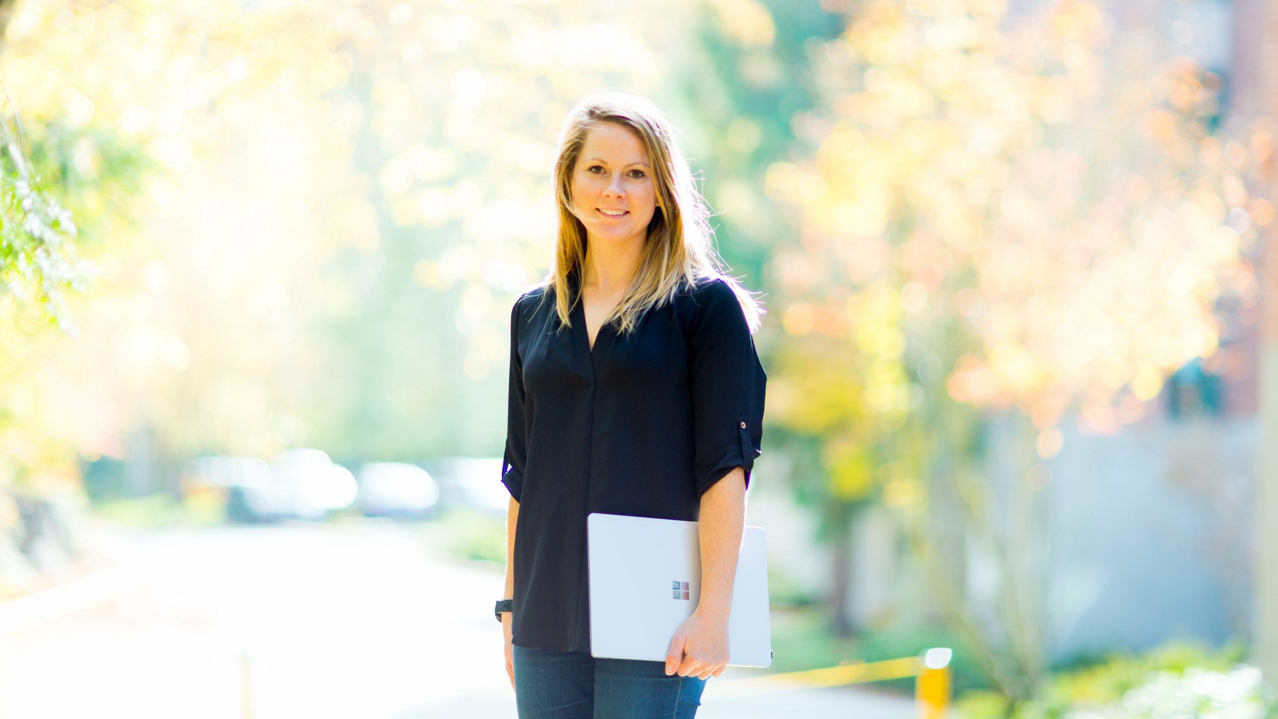 woman holding laptop