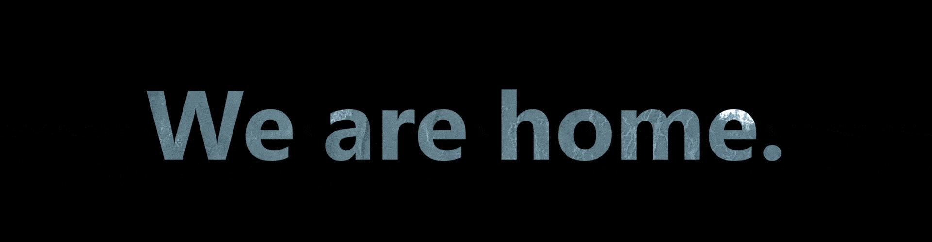 A black image with the words "We are home."