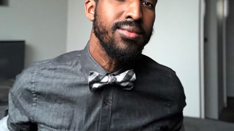 A photo of a man wearing a bowtie