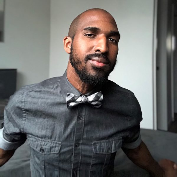 A photo of a man wearing a bowtie