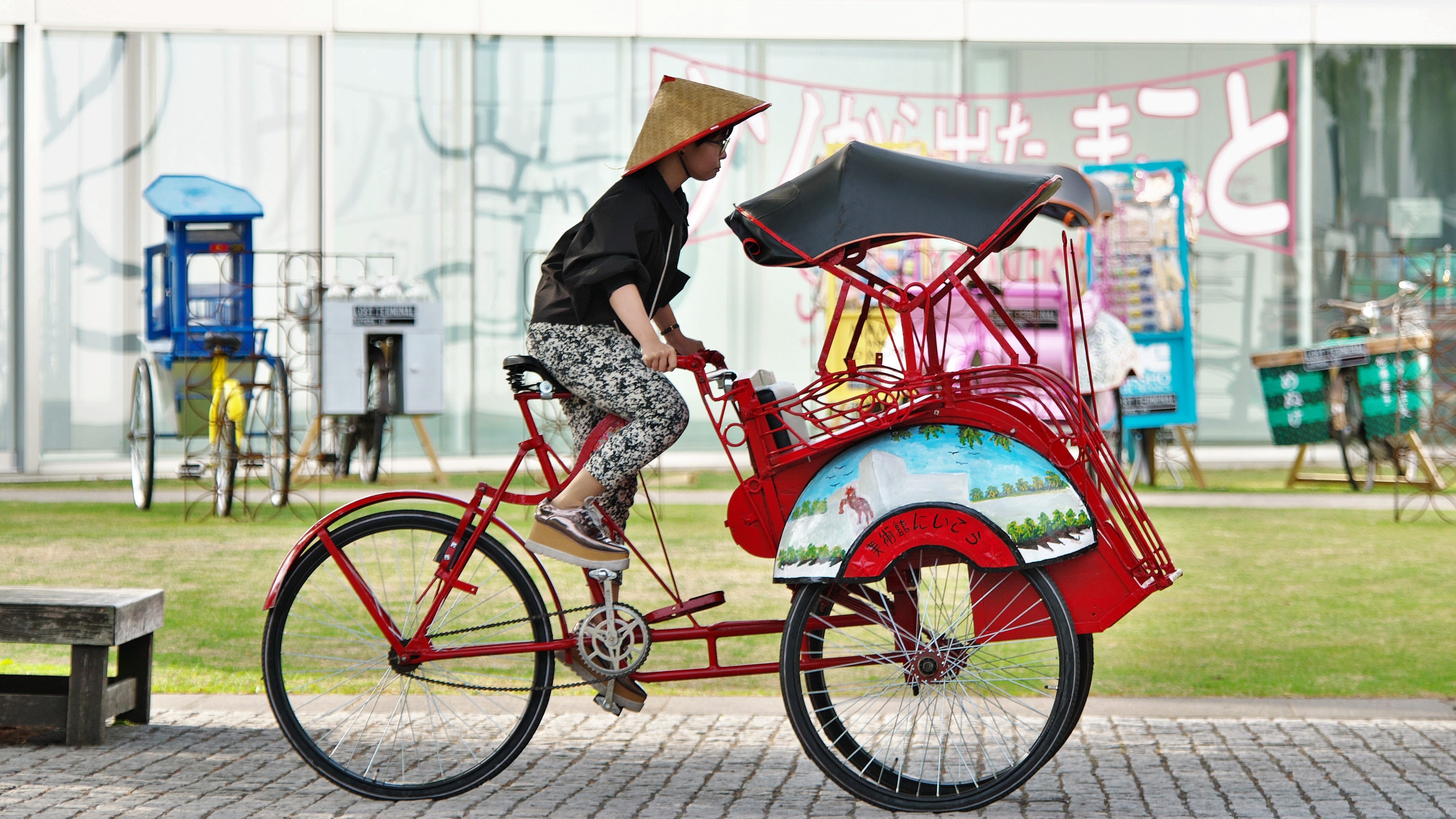 Woman rides a trishaw