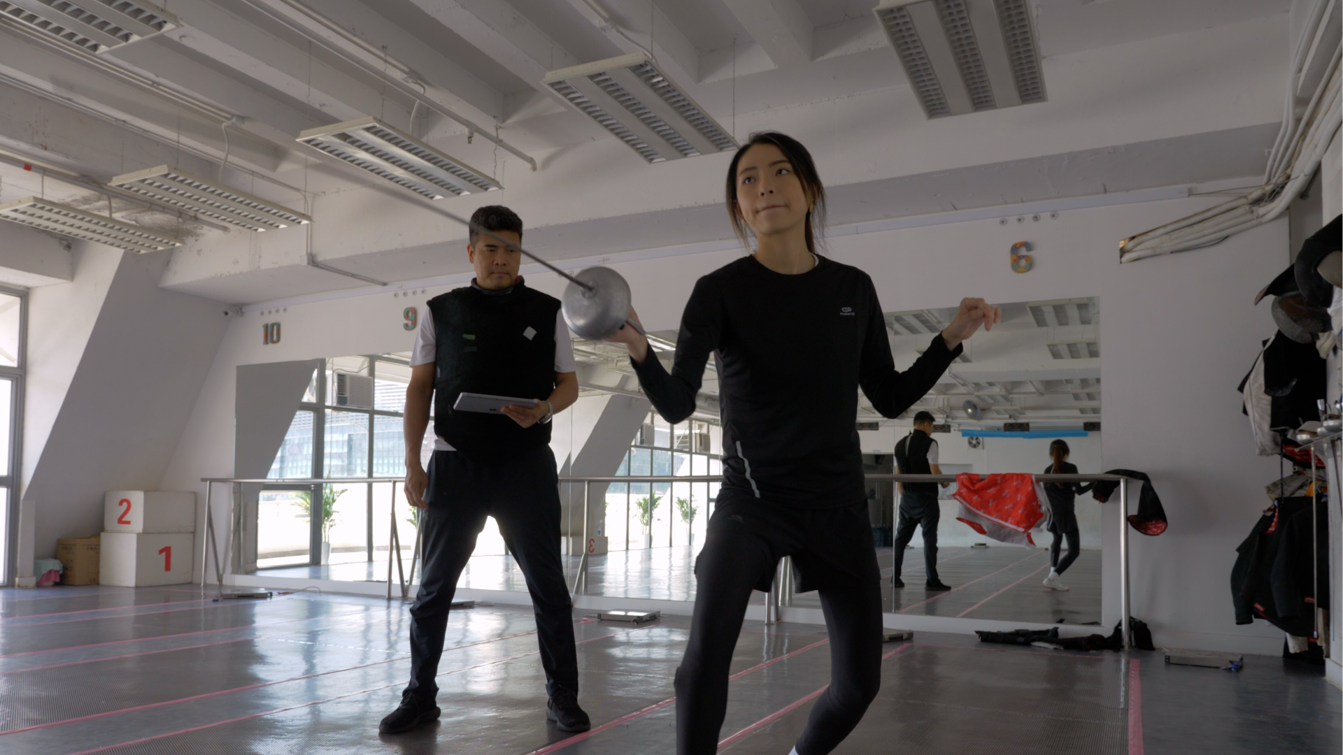 Fencer Christy Cheung trains in a RaceFit suit. Its lightweight IoT sensors provide sophisticated data on how she is moving. 