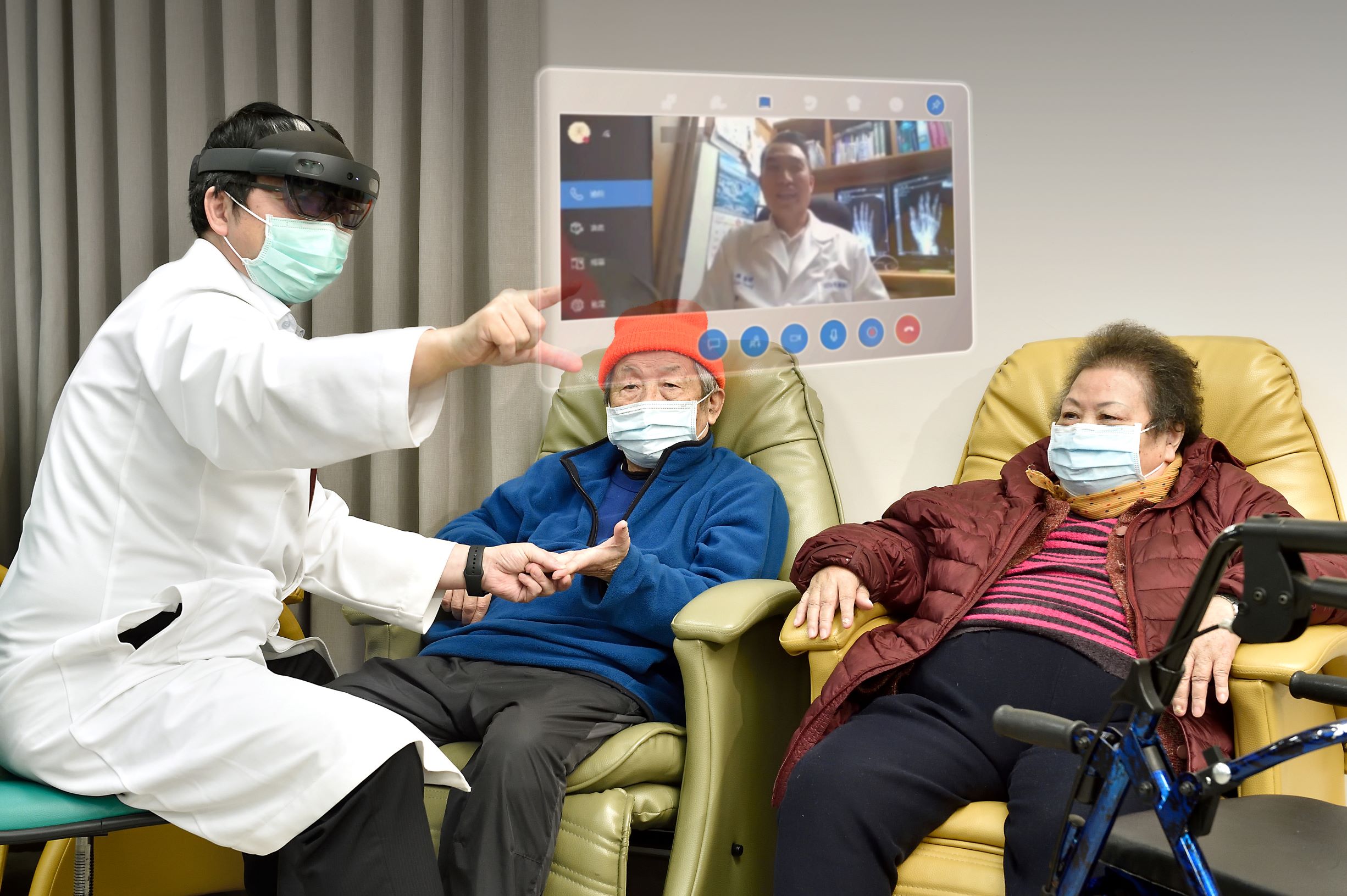 A doctors holds male patinets hand while wearing a HoloLens headset