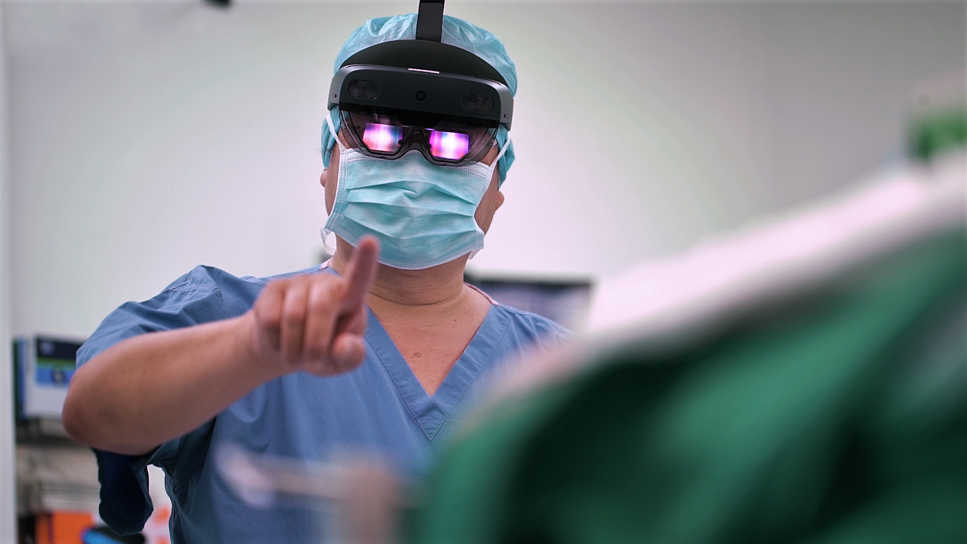 A surgeon wearing a mixed reality headset