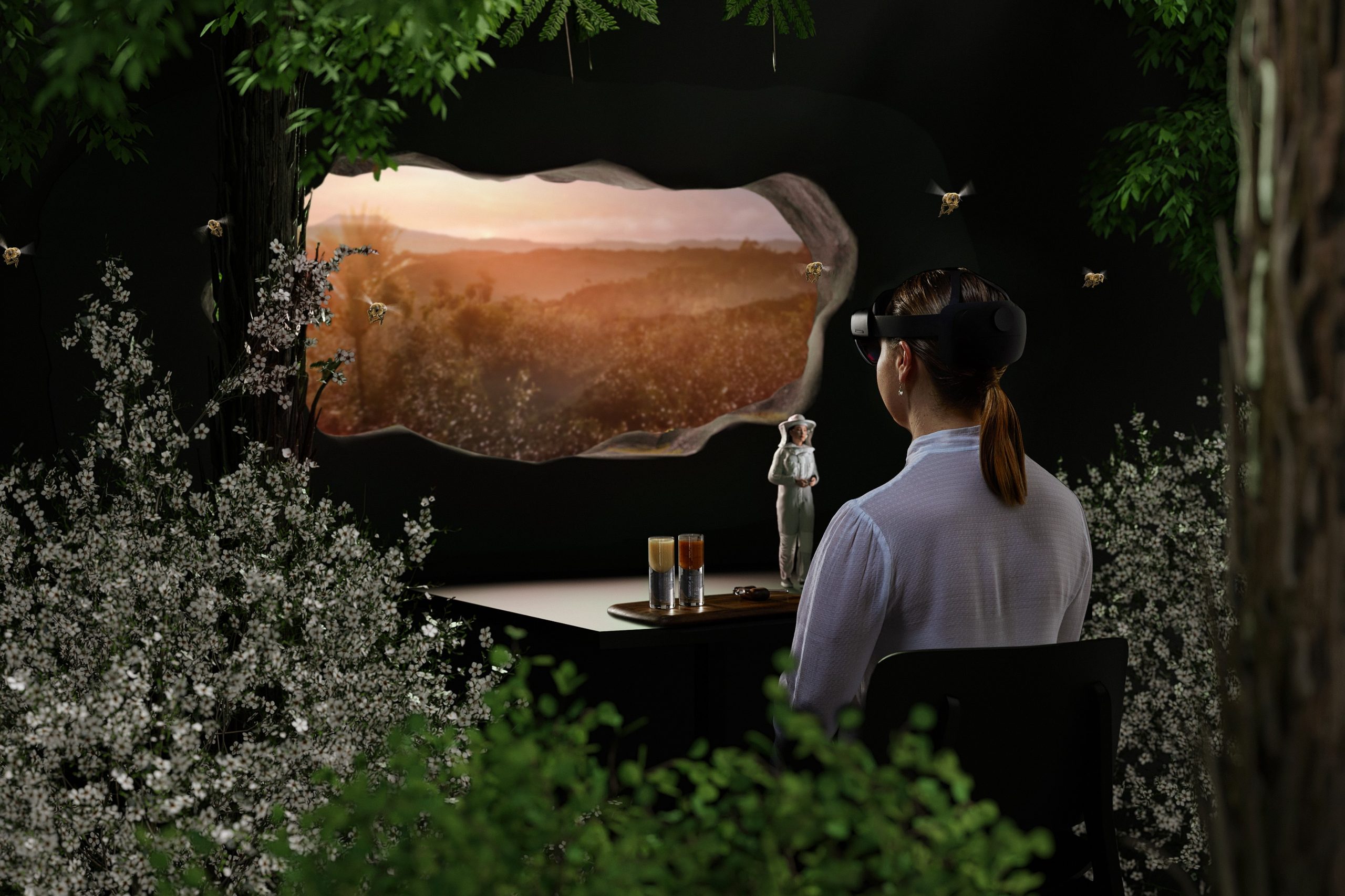 A woman wears a headset and exeences a mixed reality show depicting a dark forest.