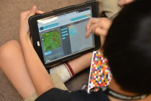 A child coding using the Minecraft tutorial