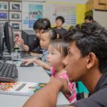 Microsoft Student Partners tutoring children on coding with Minecraft