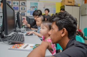 Microsoft Student Partners tutoring children on coding with Minecraft