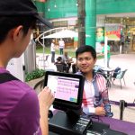 Chatime's cashier Choong taking customer orders using the new POS system