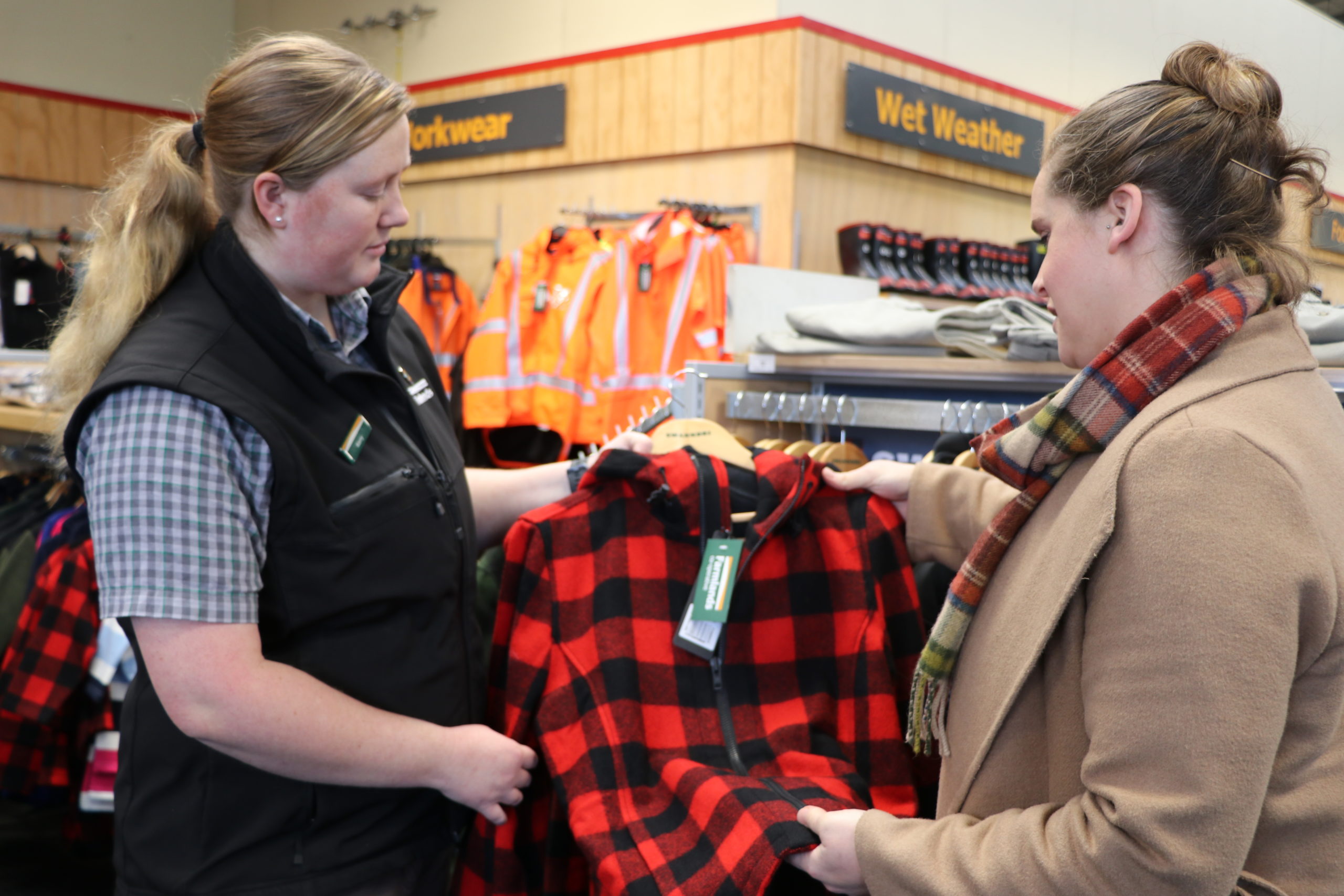Buyer examines flannel in retail store