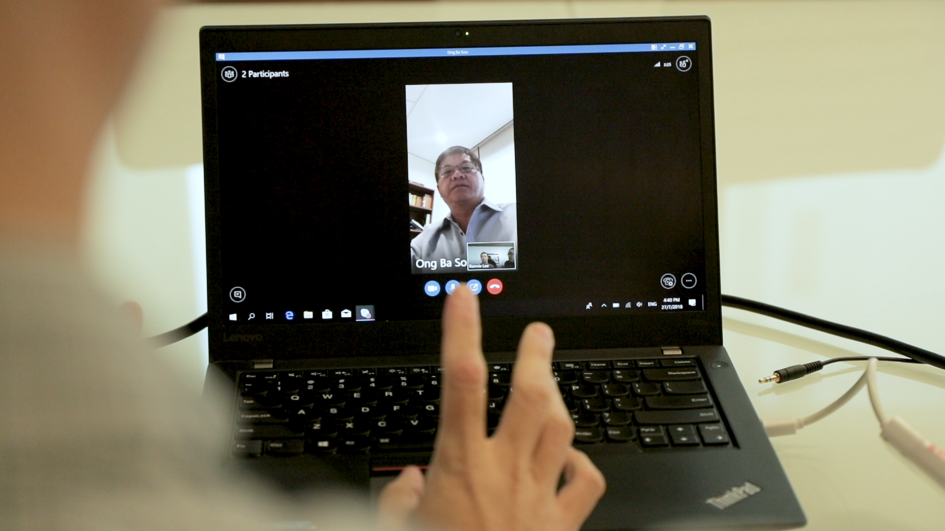 Staff using the Skype for Business on a laptop
