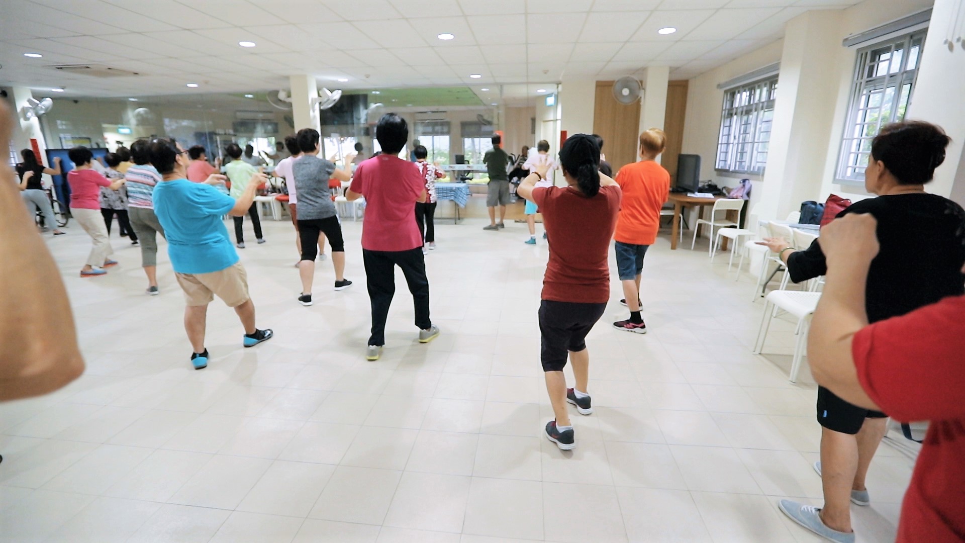 Elderly participating in a group exercise segment