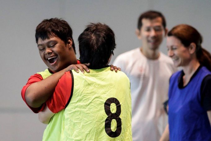 Microsoft employees enjoying a game of unified Captain's Ball with athletes from Special Olympics Singapore.