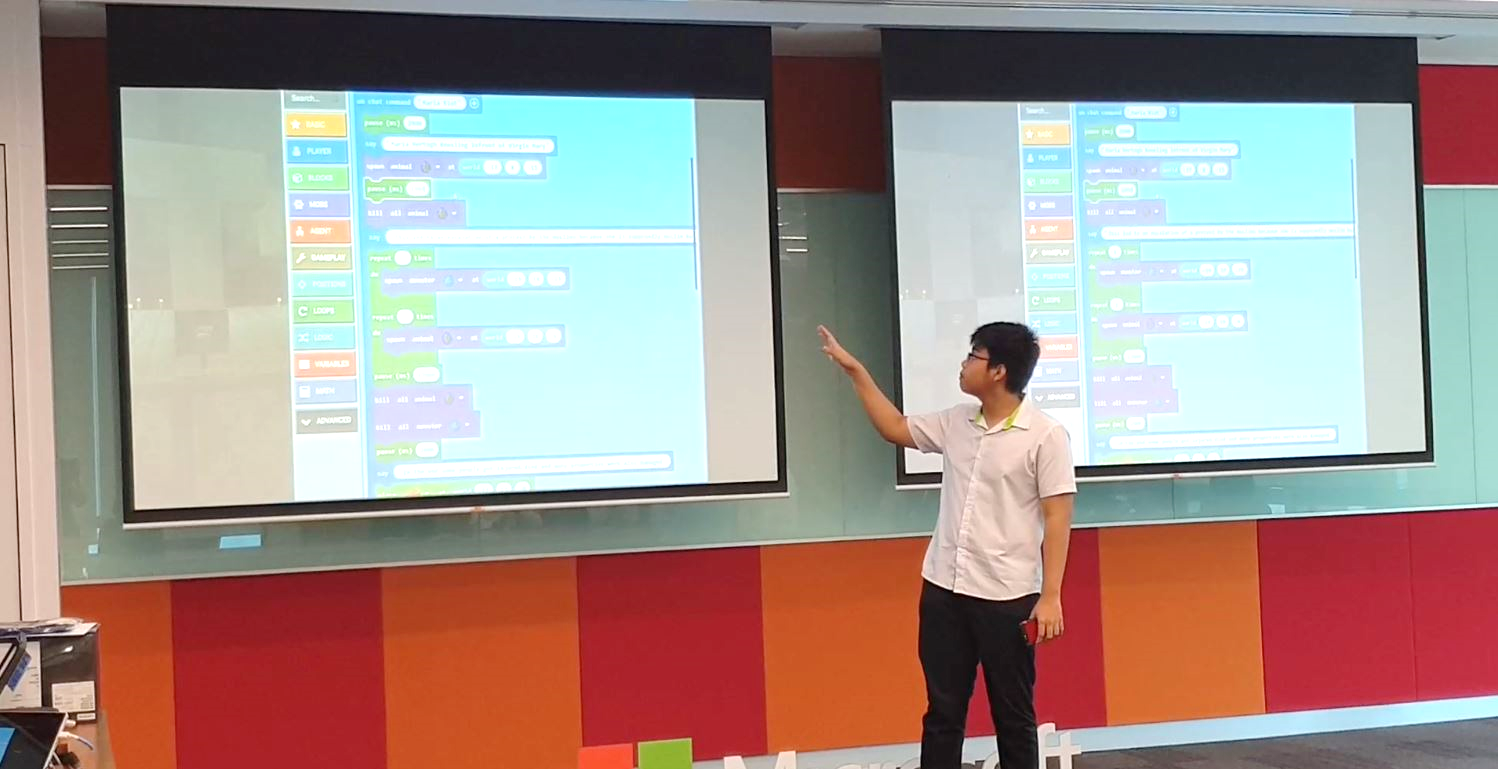 Jun Hui showcasing how he used Microsoft MakeCode to animate the riots in his virtual museum