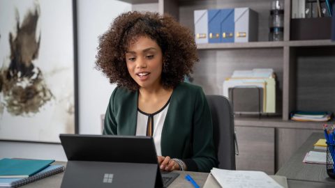 woman working on surface laptop