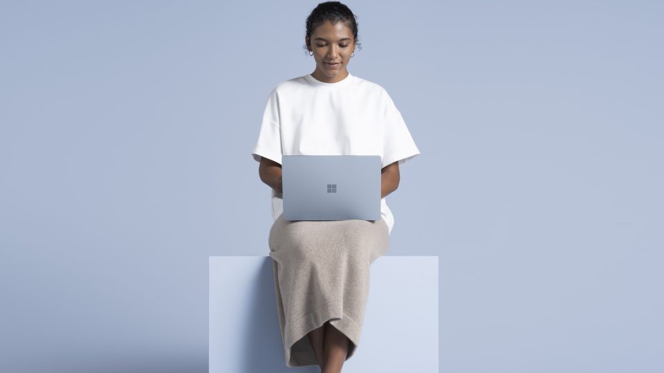 Woman with Surface device