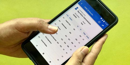 A close-up of a smartphone displaying CBSE board exam results