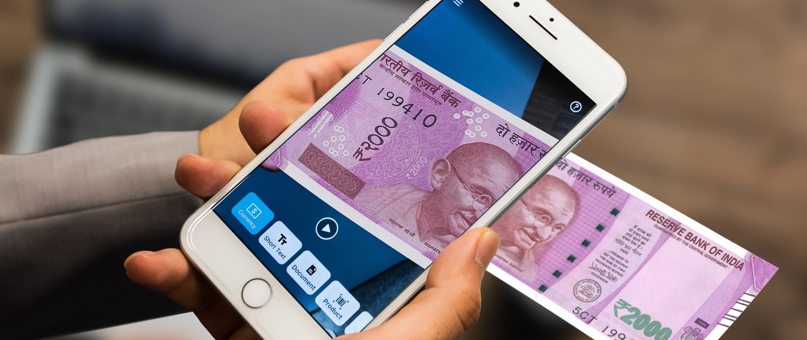 iPhone with Seeing AI app scanning a 2000 rupee note
