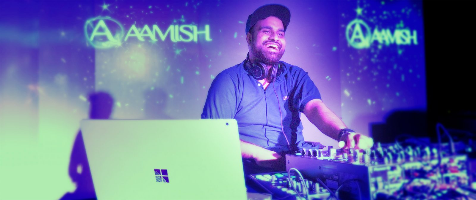 DJ Aamish playing on the console along with the Microsoft Surface Book 2